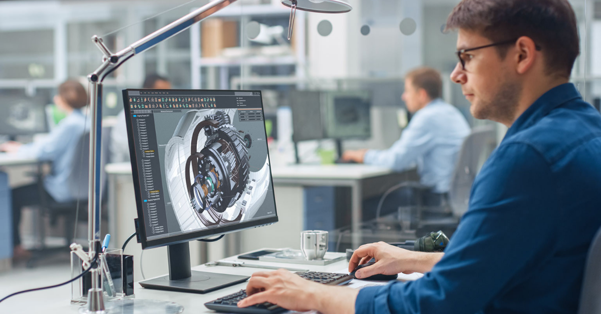 Engineer working on MCAD software designing complex mechanical systems, demonstrating the integration of MCAD and ECAD engineering