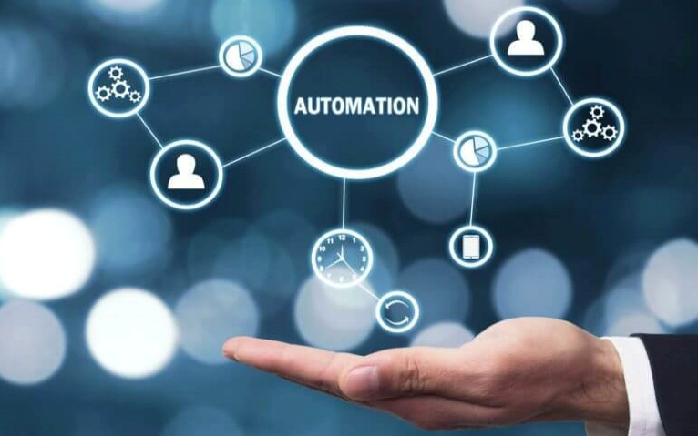 A hand supporting an automation network, symbolizing how GENESYS defines high-level architecture and interfaces, aligning solutions with problems and managing system complexity.