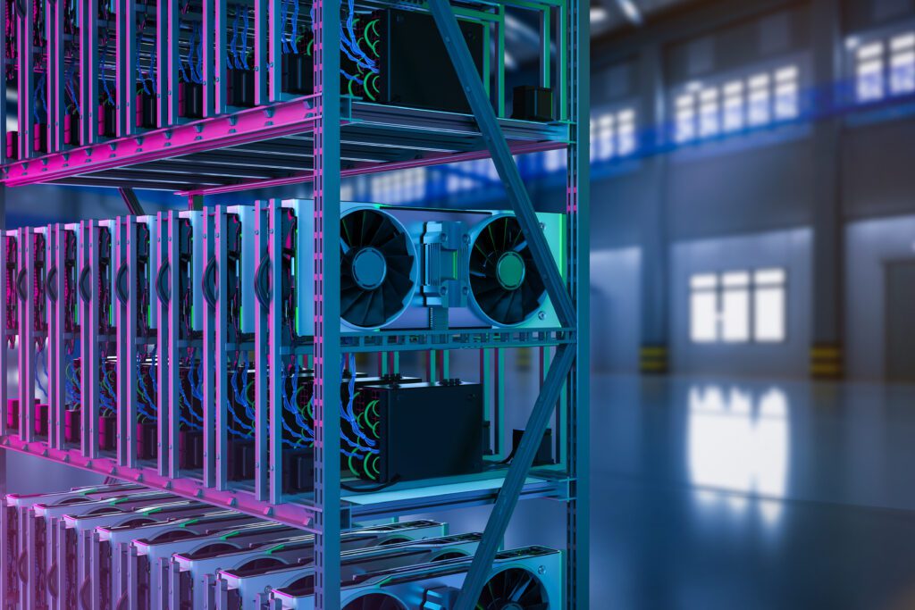 A rack containing multiple rows of GPUs in moody purple and blue light.