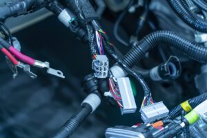 Large wide cable with wires and connectors and terminals in the wiring repair shop and electricians for connecting