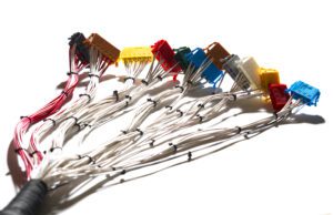 Close-up of a cable harness loom with multiple connectors, highlighting the importance of selecting the right components for optimal electrical performance.